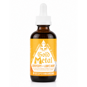 An amber glass dropper bottle of Gold Metal Cordyceps + Lion's Mane + Vesper Mushrooms liquid supplement, featuring a bright yellow label and white dropper cap on a white background.