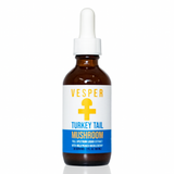 An amber glass dropper bottle of Vesper Turkey Tail Mushroom extract with a white label and blue accent band, set against a plain white background.