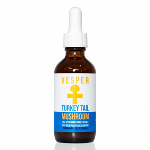 An amber glass dropper bottle of Vesper Turkey Tail Mushroom extract with a white label and blue accent band, set against a plain white background.